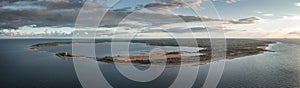 Coast and lighthouse Lange Erik in the north of the island of Öland in the east of Sweden from above during sunset