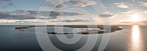 Coast and lighthouse Lange Erik in the north of the island of Öland in the east of Sweden from above during sunset