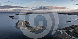 Coast and lighthouse Lange Erik in the north of the island of Öland in the east of Sweden from above during sunset