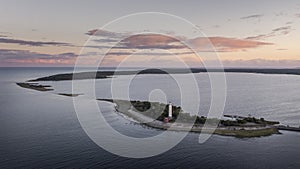 Coast and lighthouse Lange Erik in the north of the island of Öland in the east of Sweden from above during sunset