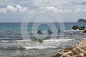 Coast of the Mediterranean Sea. Sunny day. Water motorcycles. Without people