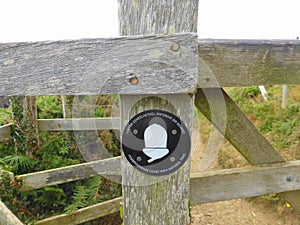 Coast path sign on gate