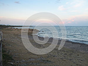 Coast with pink and blue sky at Cyprus