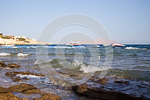 Coast of the Red Sea, Egypt. surf line. Wind and waves. A little storm. Background tourism and travel. Blue water and sky