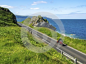 Coast Road with motorbike in Northern Ireland, UK photo