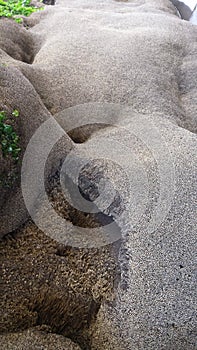 A lying naked human body, Indonesia beach rock formation by erosion