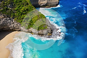 Coast with rocks as a background from top view. Blue water background from top view. Summer seascape from air. Bali island, Indone