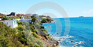 Coast, roofs, rocks, panoramic view on Salivoli, in Livorno, Tuscany, Italy