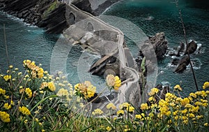 The coast from San Juan de Gaztelugatxe, Dragon-stone in Game of Thrones, bridge and stone stairs photo