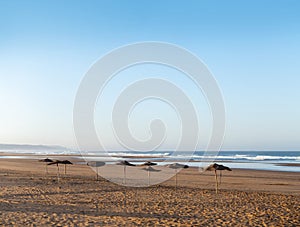 Coast of Sidi Kaouki, Morocco, Africa. Coast with umbrellas. morocco`s wonderfull surf town