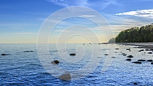 Coast stones, beach, sea, panorama, antiquity, film effect, view of the Gulf of Finland with the coast and the Baltic sea