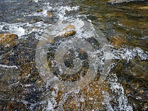 Coast stones with white spray. Rock in waterfall with heavy flow water, Can use to display, montage or retouch on Product Design,