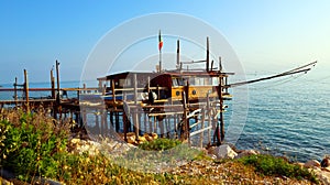 Coast of the Trabocchi, Trabocco in Marina di San Vito Chietino, Abruzzo-Italy. The Trabocco is a traditional wooden fishing house photo