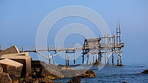 Coast of the Trabocchi, Trabocco in Marina di San Vito Chietino, Abruzzo-Italy. The Trabocco is a traditional wooden fishing house photo