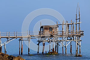 Coast of the Trabocchi, Trabocco in Marina di San Vito Chietino, Abruzzo-Italy. The Trabocco is a traditional wooden fishing house photo