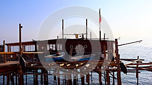 Coast of the Trabocchi, Trabocco in Marina di San Vito Chietino, Abruzzo-Italy. The Trabocco is a traditional wooden fishing house photo