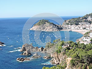 Coast view of the cliffs and beach in Costa Brava photo