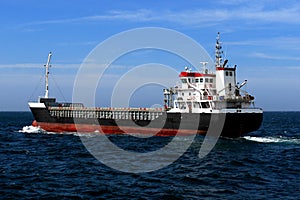 Coastal Cargo Ship Underway. photo