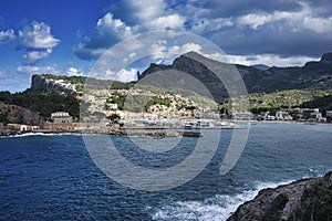 Coastal Charm: Port de Soller Embraced by Lush Mountains and Azure Seas