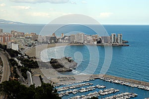 Coastal city and its marina full of boats photo