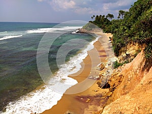 Coastal cliff sauvage beach   , Sri Lanka photo