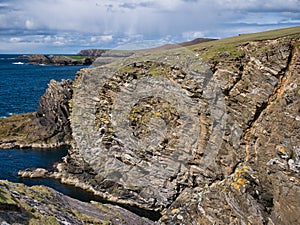 Coastal cliffs around Collaster on the west coast of the island of Unst, Shetland, UK