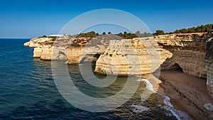 Coastal cliffs and beaches along the Percurso dos Sete Vales trail, Algarve, Portugal photo