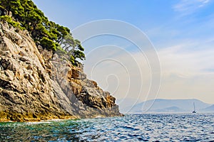 Coastal cliffs and views of the city of Dubrovnik from the side of the Adriatic Sea from afar. Croatia