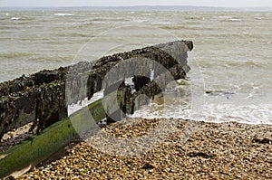 Coastal defenses to help prevent coastal erosion on the pebble beach in Titchfield, Hampshire on the south coast of England