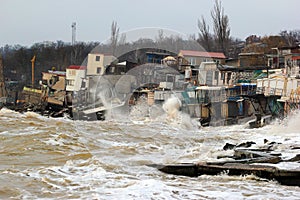 Coastal erosion - houses built on weak clay soil slide down to sea