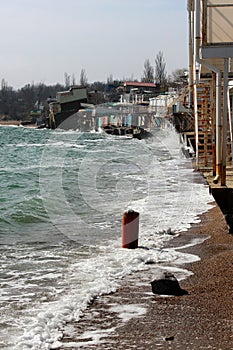 Coastal erosion - houses built on weak clay soil slide down to sea