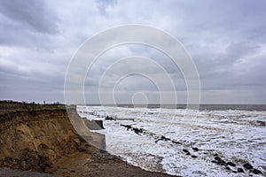 Coastal errosion taking place duirng a winter storm. Many homes have recently been lost in this community due to coastal errosion