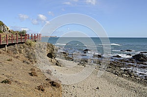 Coastal footpath over beach rocks