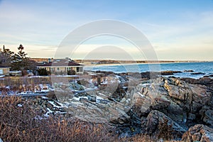 Coastal house on Marginal Way path at sunset in Ogunquit Maine during winter