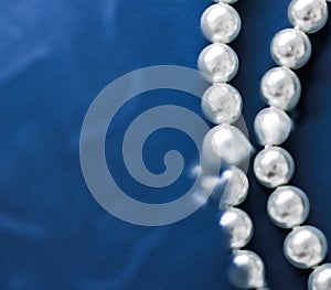Coastal jewellery fashion, pearl necklace under blue water background, glamour style present and chic gift for luxury jewelery