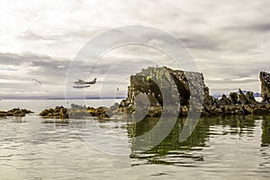 Coastal Kodiak, Alaska with gulls and floatplane photo