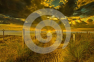 Coastal landscape at sunset and last rays of the sun shine