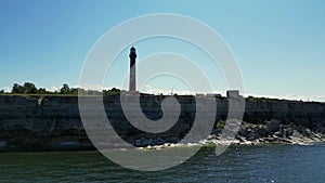 Coastal lighthouse. Lighthouse at Baltic Sea. Aerial drone in Paldiski, Estonia.