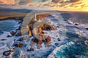 Coastal lighthouse during the red sunset