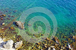 The coastal line in Herceg Novi: a view from above of the bright clear waters of the Adriatic Sea.