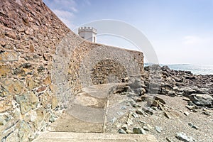 Coastal location around st michaels mount in cornwall england uk. Lookout post in Marizion harbour. White castlated building next