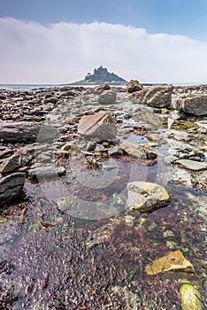 Coastal location around st michaels mount in cornwall england uk. Lookout post in Marizion harbour. White castlated building next