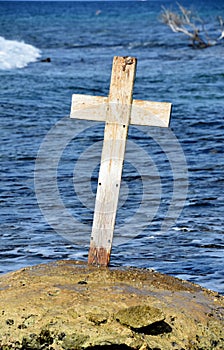 Coastal Memorial with a Worn Wood Cross