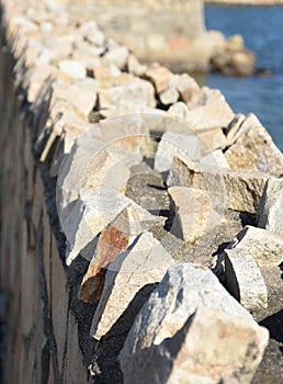 Coastal Retaining Wall with Sharp Jagged Rocks