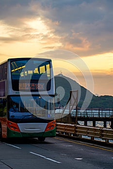 Coastal road and double decker bus in Kennedy Town, Hong Kong