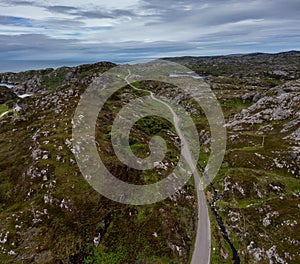 Coastal road on the North Coast 500 scenic drive in the Scottish Higlands near Lochniver