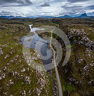 Coastal road on the North Coast 500 scenic drive in the Scottish Higlands near Lochniver