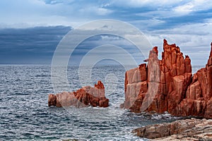 Coastal rock formations Rocce Rosse in Sardinia, Italy photo