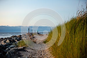 Coastal sand walkway by jetty