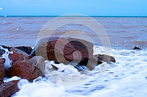 coastal stones in the surf